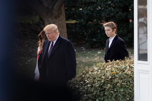 Donald and Melania Trump with their son Barron prior to their departure from the White House in Washington, DC., on Tuesday, November 20, 2018. 