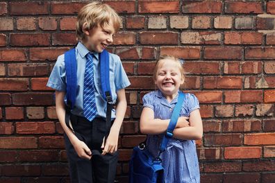 Boy and girl in school uniforms