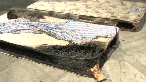 Mattresses from the burning bedroom where police believe two children were deliberately trapped. (Supplied)