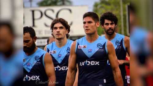 Martin-Page (second from right) was playing in the NTFL when he was injured.