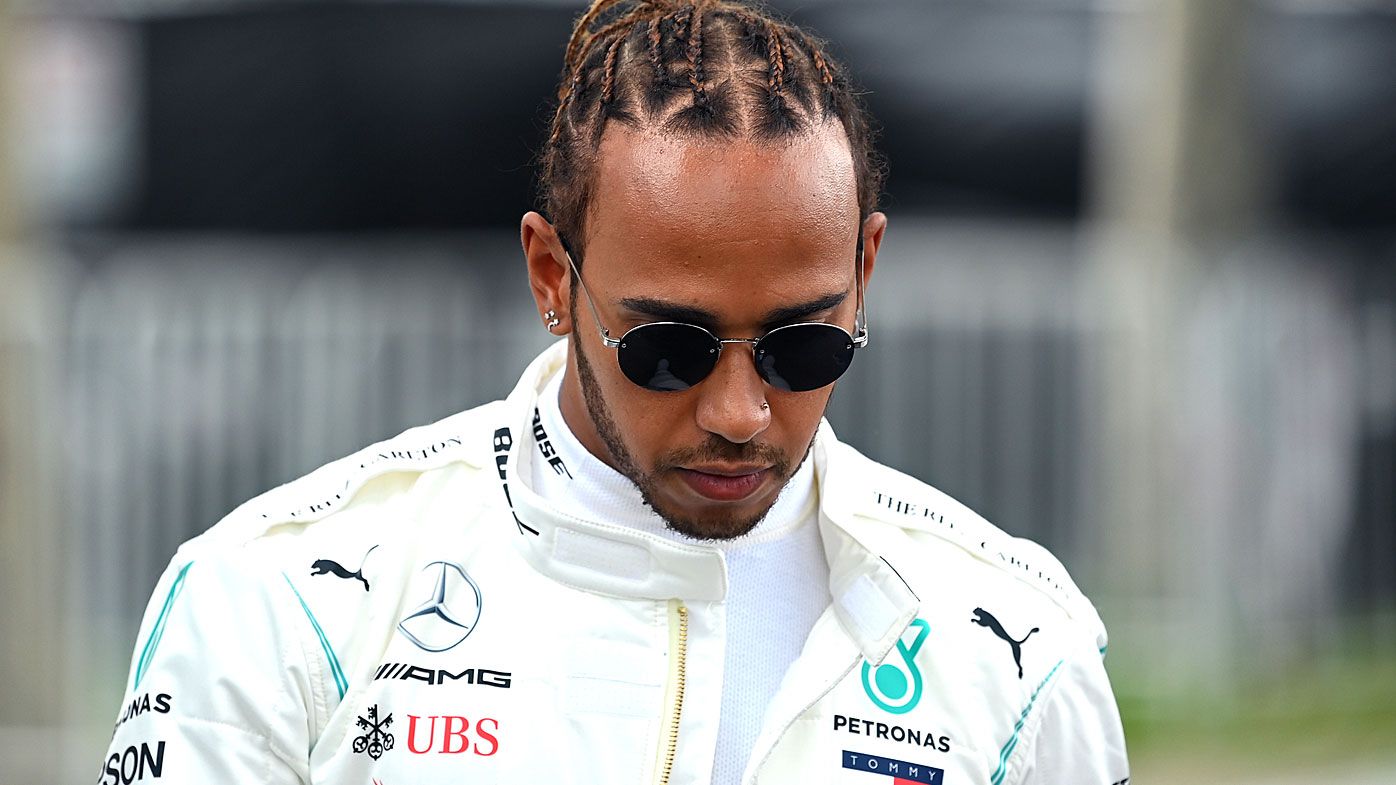 Lewis Hamilton of Great Britain and Mercedes walks in the Paddock 