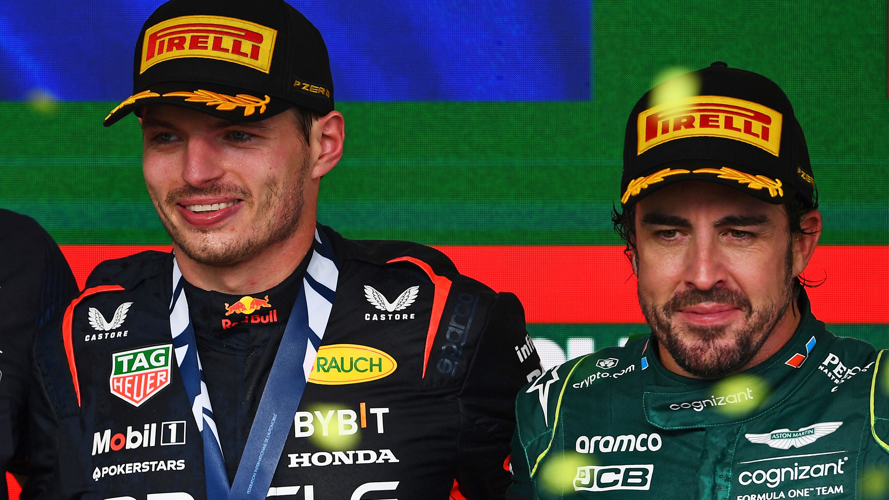 Three-time F1 champion Max Verstappen (left) with two-time champ Fernando Alonso.