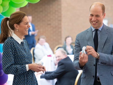 Kate laughed as Prince William spoke to the gathered crowd.