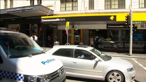 A man armed with a knife is on the run after attempting to rob a Sydney CBD Commonwealth Bank. (9NEWS)