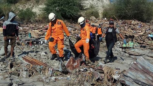 Following the Indonesian earthquake and tsunami rescuers are combing the wreckage for bodies.