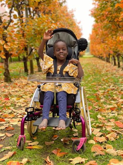 Akuch has cerebal palsy and chose bright yellow wheels for her chair