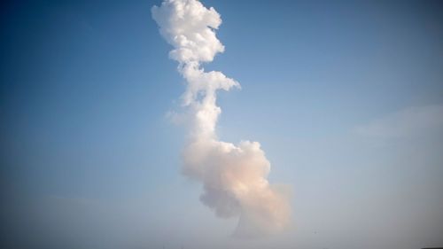A plume of exhaust trails from a Starship rocket after a test launch from South Texas on May 27.
