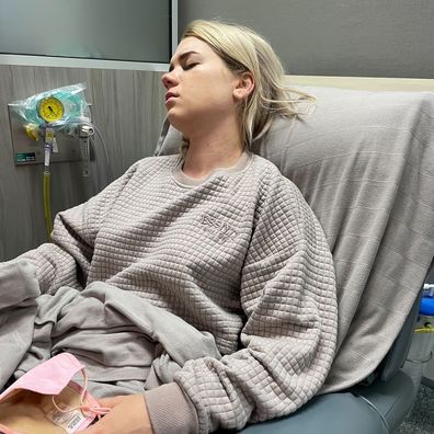 Ella Collings in hospital during an endometriosis flare up.