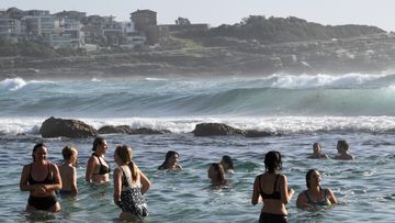 Beachgoers cool off at Bronte Beach in Sydney.