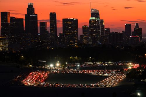 LA residents queues in their cars at Dodger Stadium to take a coronavirus test.