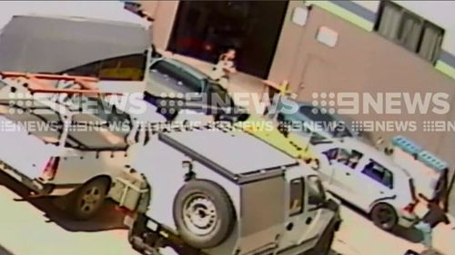 A man then exits the vehicle with his hands raised in the air as the officer stands in front of the car. Picture: Supplied.