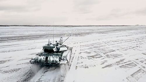 In this photo taken from video and released by the Russian Defense Ministry Press Service on Wednesday, Feb. 2, 2022, a tank drives during a Russian and Belarusian joint military drills at Brestsky firing range, Belarus. 