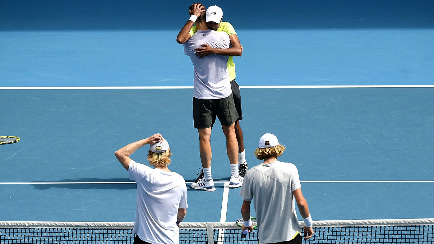Joe Salisbury of Great Britain and Rajeev Ram of the USA celebrate after winning the men&#x27;s doubles final against Luke Saville and Max Purcell 
