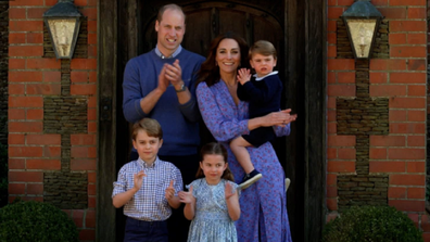 The Duchess of Cambridge clapped while holding Prince Louis.