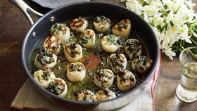 Grilled scallops with lemon, olive, caper and parsley butter