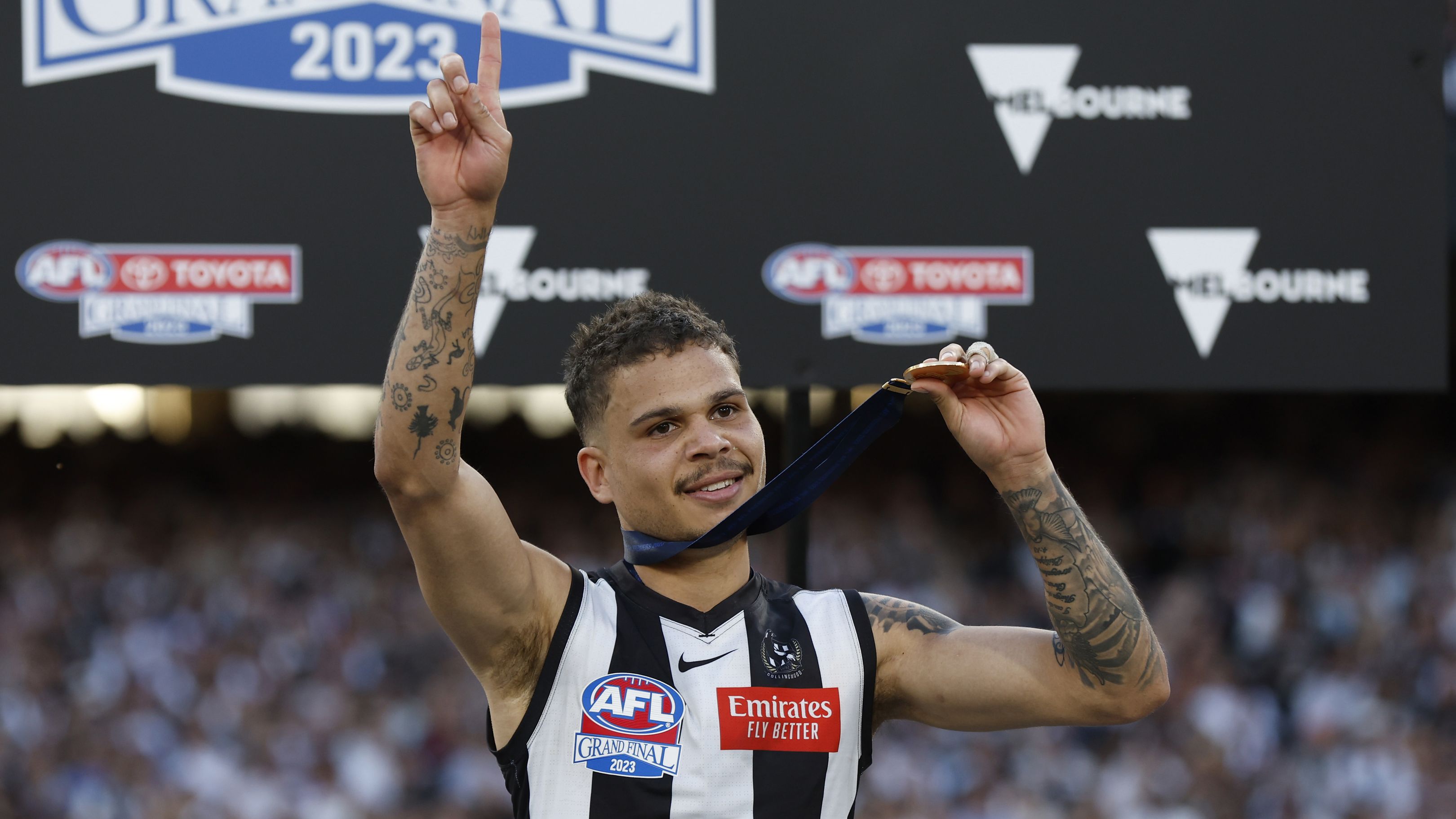 MELBOURNE, AUSTRALIA - SEPTEMBER 30: Bobby Hill of the Magpies celebrates after the 2023 AFL Grand Final match between Collingwood Magpies and Brisbane Lions at Melbourne Cricket Ground, on September 30, 2023, in Melbourne, Australia. (Photo by Darrian Traynor/AFL Photos/via Getty Images)
