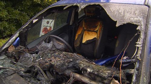 Flames engulfed the blue hatchback. Picture: 9NEWS