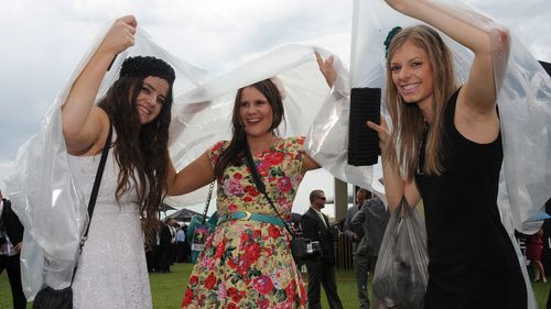 Punters don't usually let rain get in the way for a good day at the races.