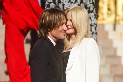Nicole Kidman and Keith Urban share a moment before the Fall / Winter Haute Couture Fashion Show