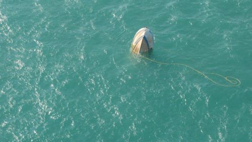 Two fishermen have been rescued after their boat capsized in rough seas north-east of Darwin. (supplied)