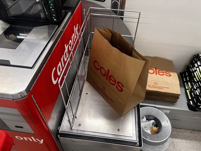 shopping bags at supermarket groceries coles woolworths aldi 
