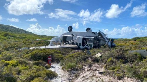 The plane, upside down and badly mangled, crashed trying to land on Lizard Island.