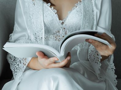 Woman reading journal.