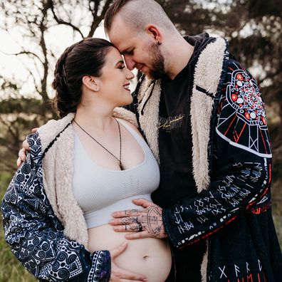 Maddison Granger with her husband while pregnant with twin daughters.