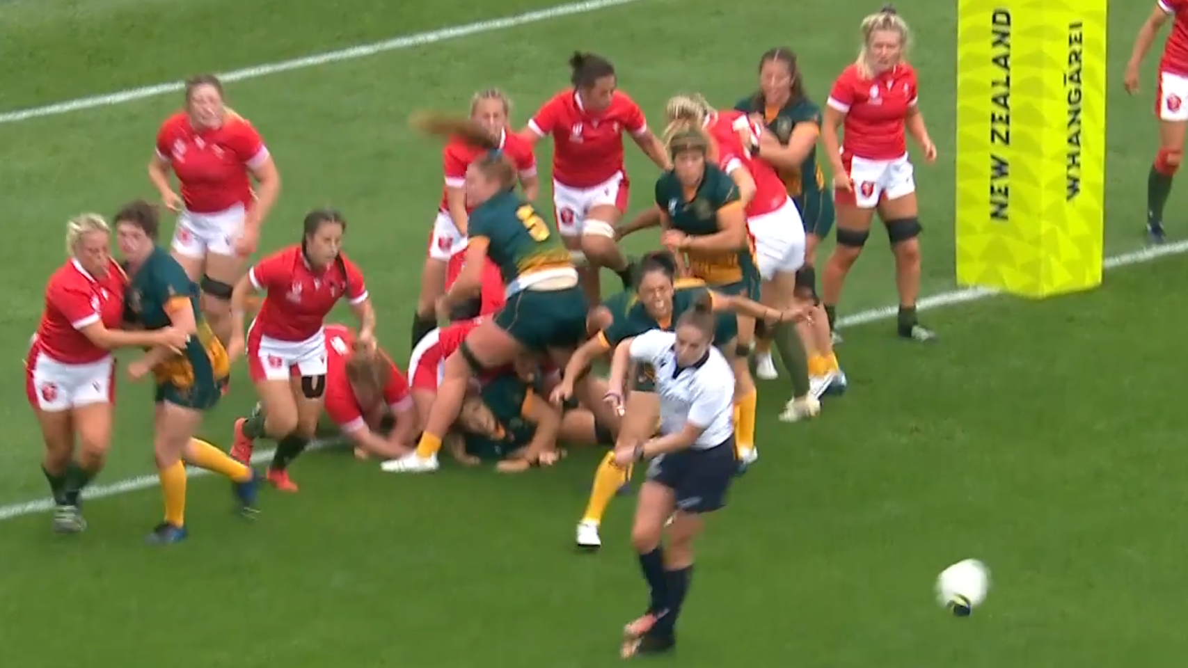 Referee Sara Cox gets in the way of the Australian attack.