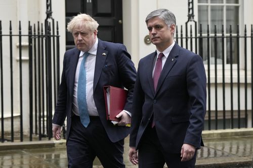Boris Johnson (left) leaves 10 Downing Street with the Ukrainian Ambassador to the United Kingdom Vadym Prystaiko (right) for his weekly Prime Minister's Questions in the House of Commons, in London, Wednesday, March 2, 2022. 