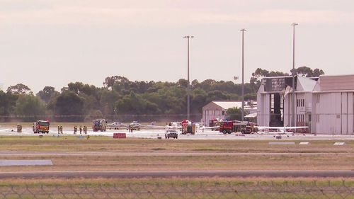 A light plane has crashed into an aircraft hangar in South Australia, just north of Adelaide. Police were called to an area near Kingsï»¿ Road at Parafield after reports the small aircraft had collided with the hangar as the aircraft attempted to land at the airport.