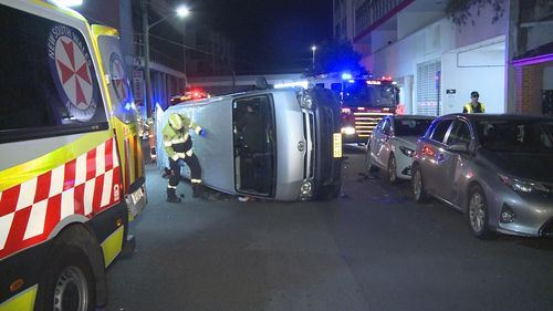 An allegedly drunk driver was charged after flipping his van and taking out several parked cars in Sydney's south.