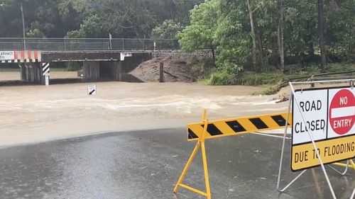 Low lying roads on the Sunshine Coast turning into creeks after heavy downpours this morning. 