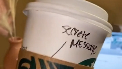 He had written 'secret message' with the words hidden under the coffee collar.