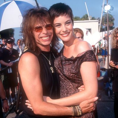 1993:  American singer-songwriter Steven Tyler and his daughter Liv Tyler pose for a portrait circa 1993.  (Photo by Ron Davis/Getty Images)