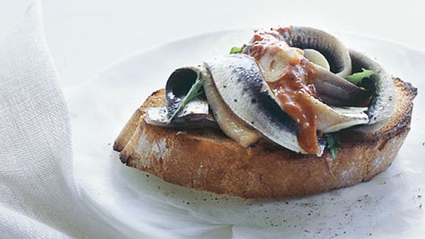 Marinated sardines on toast with piquillo pepper vinaigrette