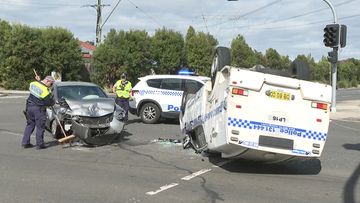 The safety of police caged trucks is in question after one crashed while heading to a job in Sydney&#x27;s East.Two luxury cars were damaged in the collision but the officers escaped serious injury.