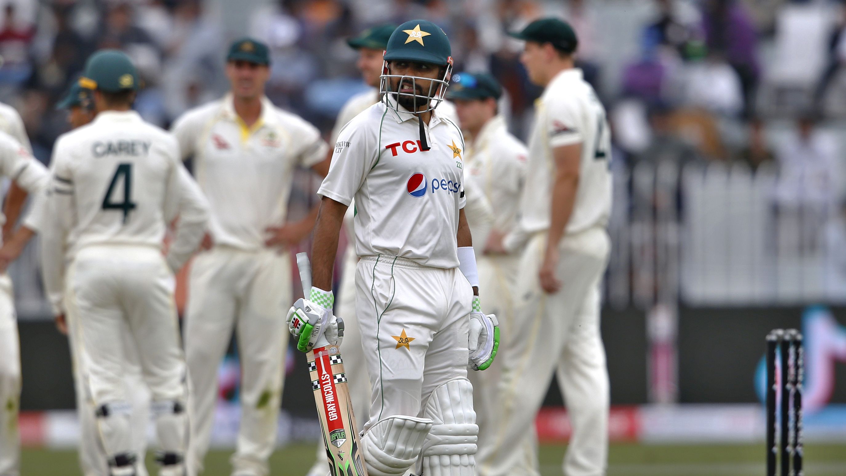 Pakistans Babar Azam reacts as he walks back to pavilion after his dismissal during the 2nd day of first cricket test match between Pakistan and Australia at the Pindi Stadium.