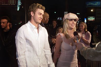 Britney Spears and then-boyfriend Justin Timberlake arrive at the premiere of her movie "Crossroads" in 2002. 