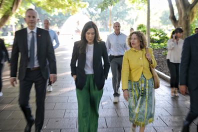 Princess Mary of Denmark, escorted by City of Sydney staff and security, tours Hyde Park, 27 April 2023