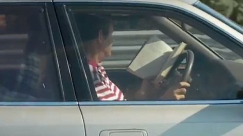 This driver actually decided reading a book would be a safe option