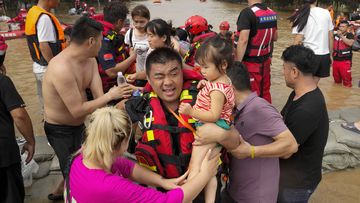 Rescuers using rubber boats evacuate trapped residents through floodwaters in Zhuozhou in northern China&#x27;s Hebei province, south of Beijing, Wednesday, Aug. 2, 2023. China&#x27;s capital has recorded its heaviest rainfall in at least 140 years over the past few days. Among the hardest hit areas is Zhuozhou, a small city that borders Beijing&#x27;s southwest. (AP Photo/Andy Wong)