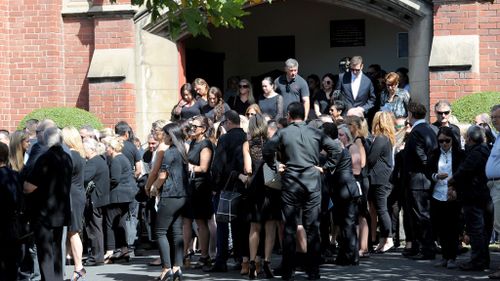 Mourners pay their final respects. (AAP)