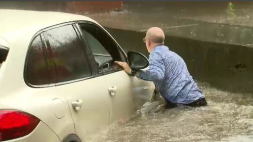 The helpless Porsche driver on the inundated Dudley Street.