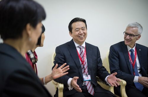 China's Meng Hongwei (C), elected President of Interpol speaking in Bali, Indonesia