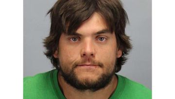 Matthew C. Bockhart, 28, allegedly hit the victim as he was advertising with signage near Gratiot Avenue and Linnhurst Street for a local business.