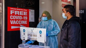 A health worker is seen in a medical centre in Lakemba in Sydney which offers COVID-19 vaccines.