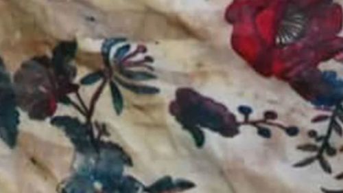 This picture shows the pattern on the floral tank top the woman was wearing.