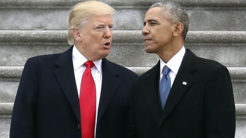 President Donald Trump talks with former President Barack Obama on Capitol Hill in Washington in January 2017.