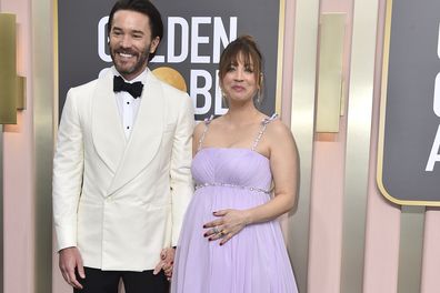 Tom Pelphrey, left, and Kaley Cuoco arrive at the 80th annual Golden Globe Awards at the Beverly Hilton Hotel 